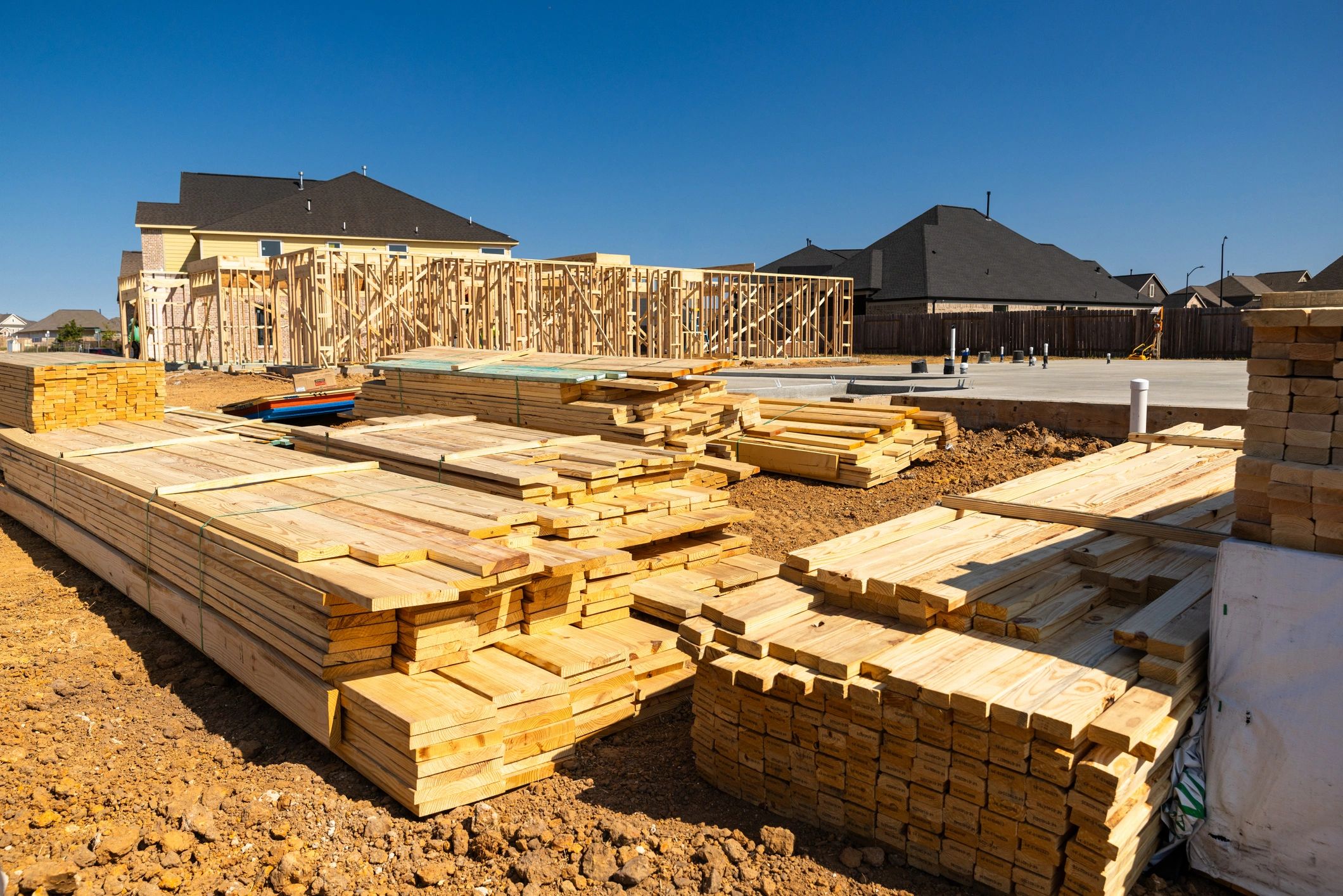 Residential construction site with framing and concrete foundation for a secondary dwelling unit project